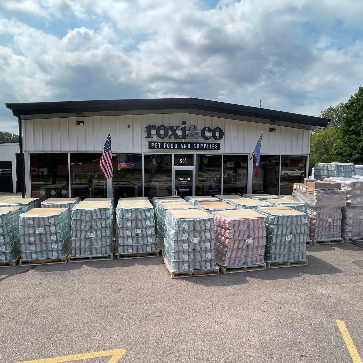 Pallets of donated NutriSource dog food outside the Roxi & Co store in Sioux Falls.